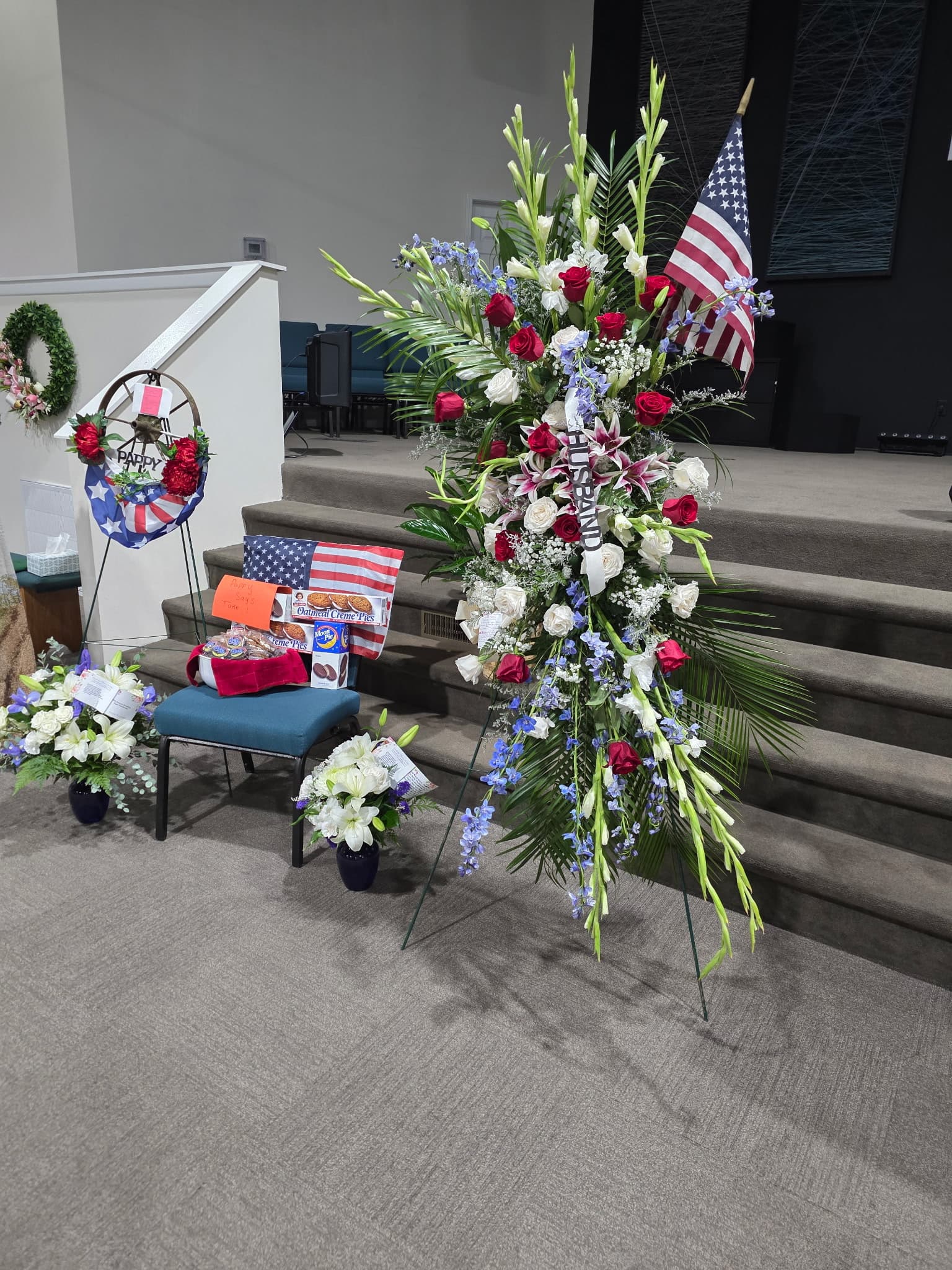 Patriotic funeral tribute display with American flags - real client work
