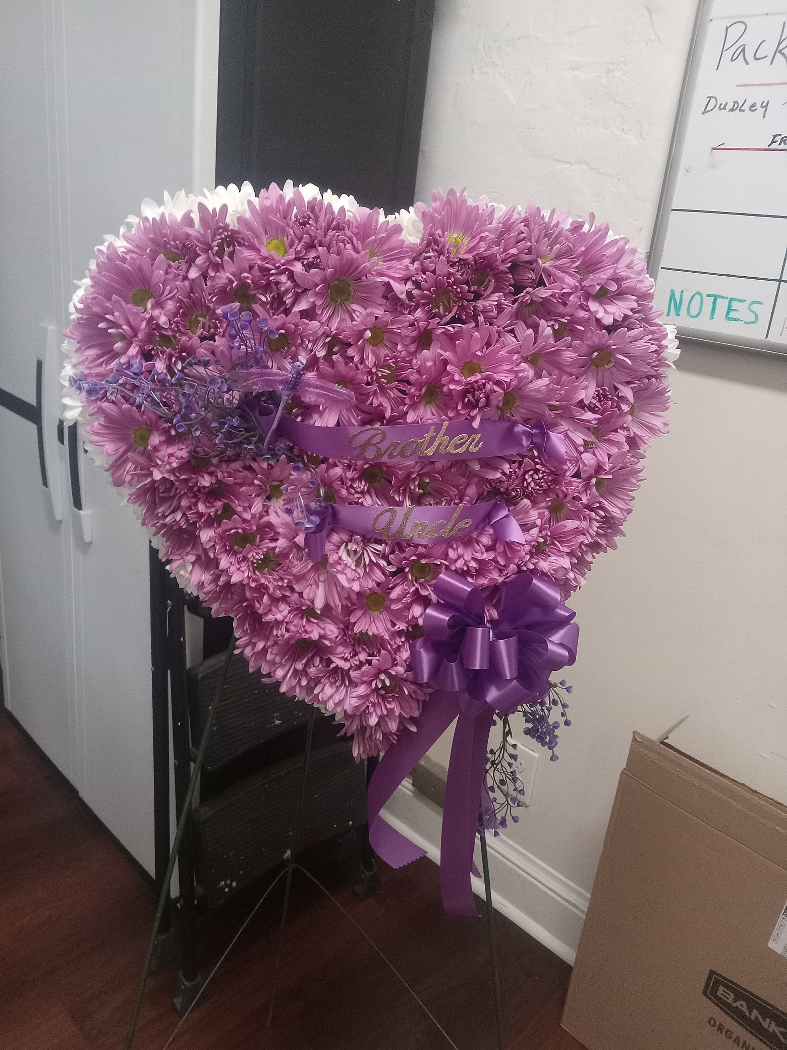 Purple heart-shaped funeral floral arrangement - real client work